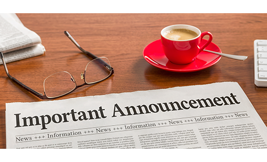 newspaper-on-wooden-desk-important-announcement.png