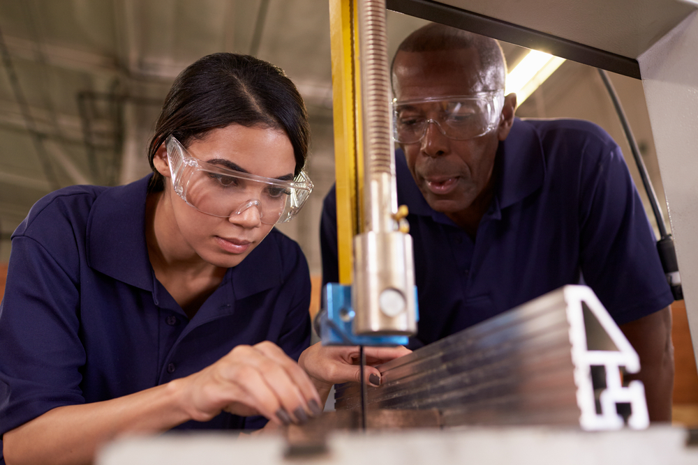 Image of two industrial workers, a woman and a man