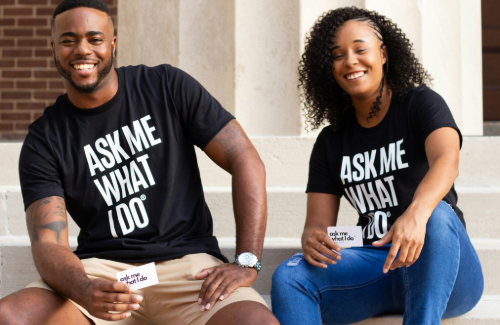 picture of a man and a woman who are wearing shirts that say "ask me what I do"