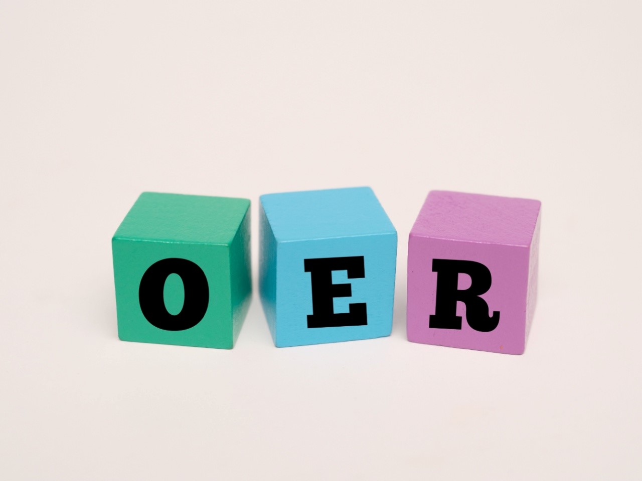 multicolored blocks with the letters O E R