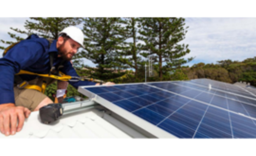 Man working on solar panel
