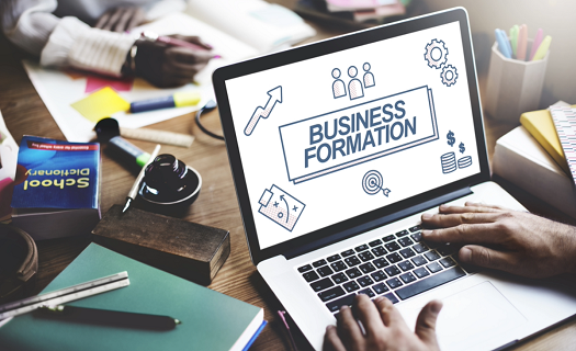 Business formation words on laptop screen