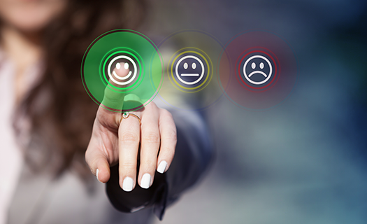 businesswoman-pressing-smiley-face-emoticon-on