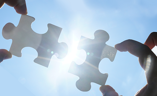 two-hands-trying-connect-couple-puzzle