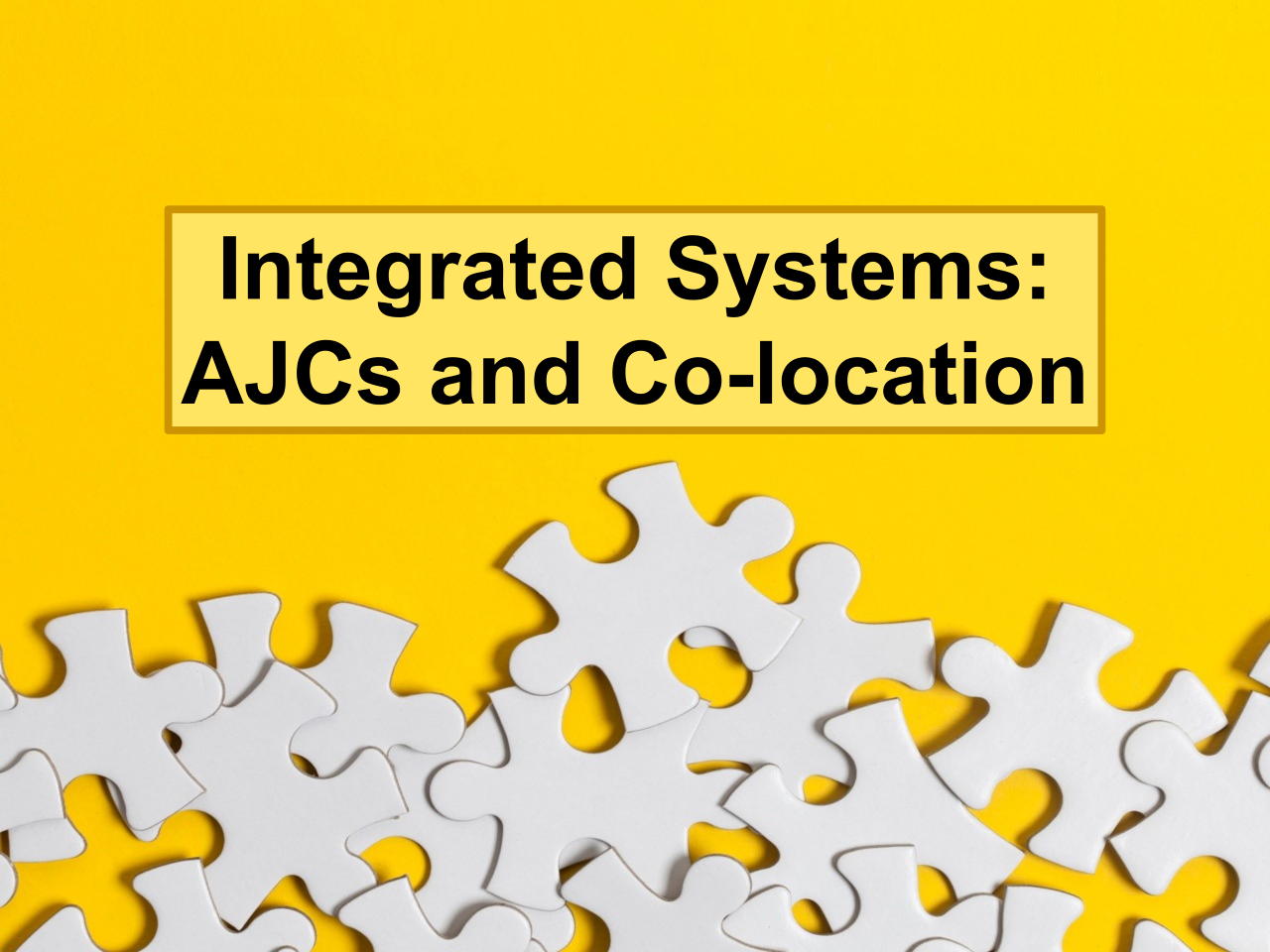 Puzzle pieces on a yellow background with text Integrated Systems AJCs and Co-location