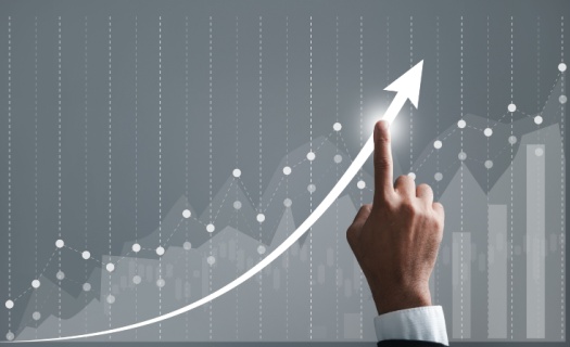 hand moving along line chart that shows an increase on the horizon line