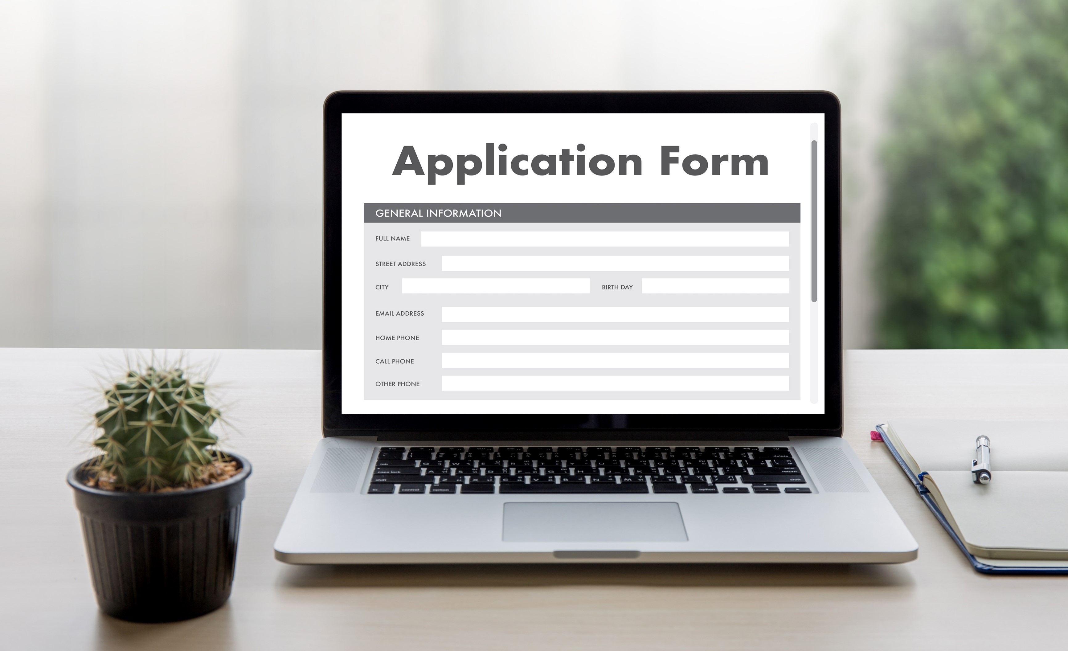  laptop computer displaying an Online Web Job Application Form on monitor