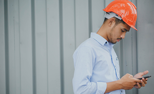Young-male-orange-safety-engineer-helmet.png