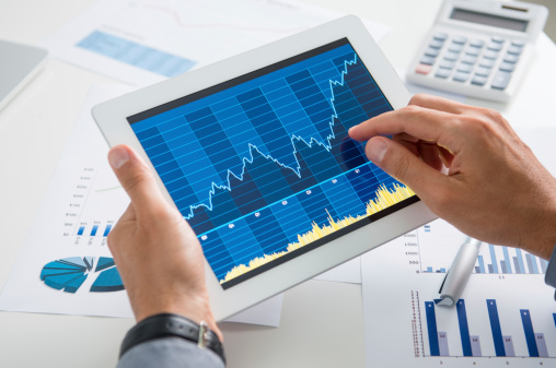 Man holding tablet with longitudinal data