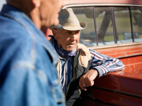 Workers talking by their trucks