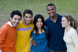 Group of five young people smiling