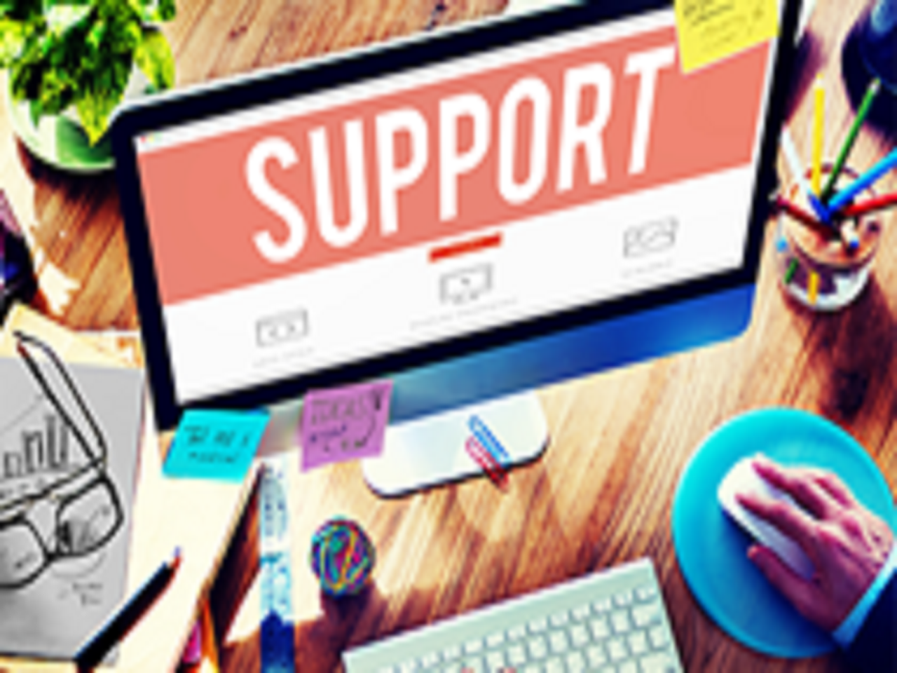 Computer monitor with large word visible: "Support"