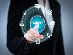 Image of man pressing contact us on a screen