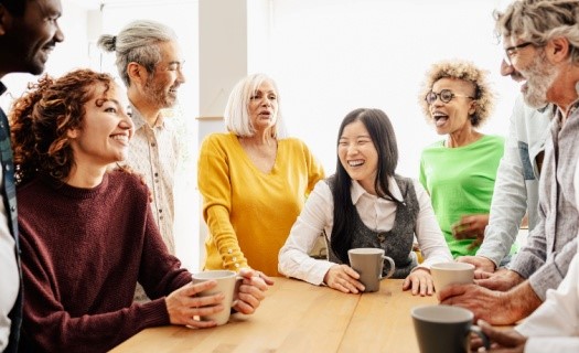 Diverse group of people sitting around a table