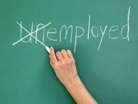 A hand crossing out the "un" in unemployed