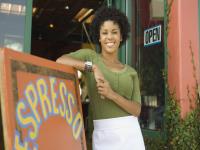 Woman standing next to sign
