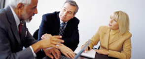 Picture of business people talking around a conference table