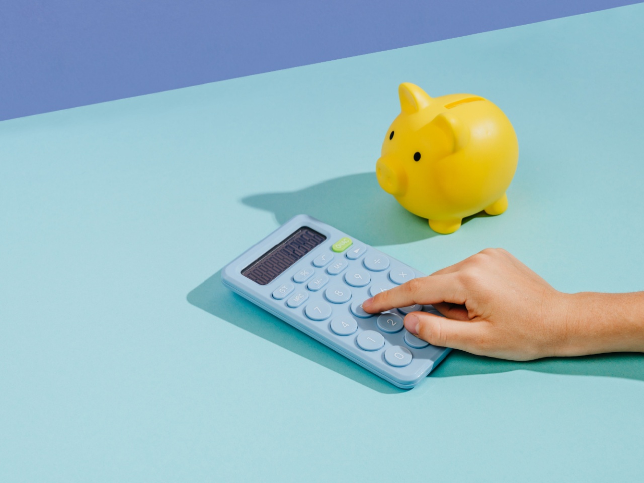 calculator and piggy bank