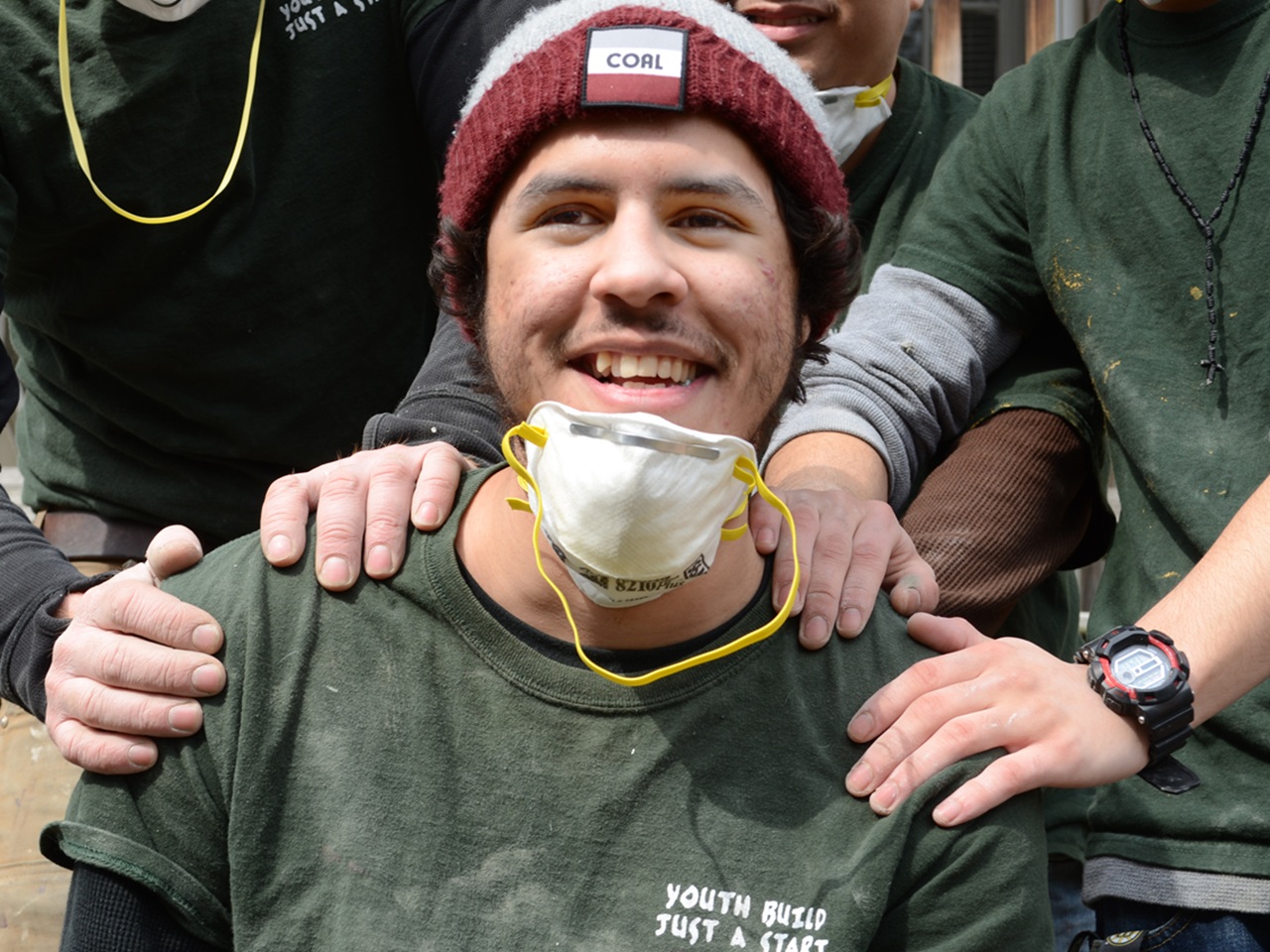 Smiling young person in PPE