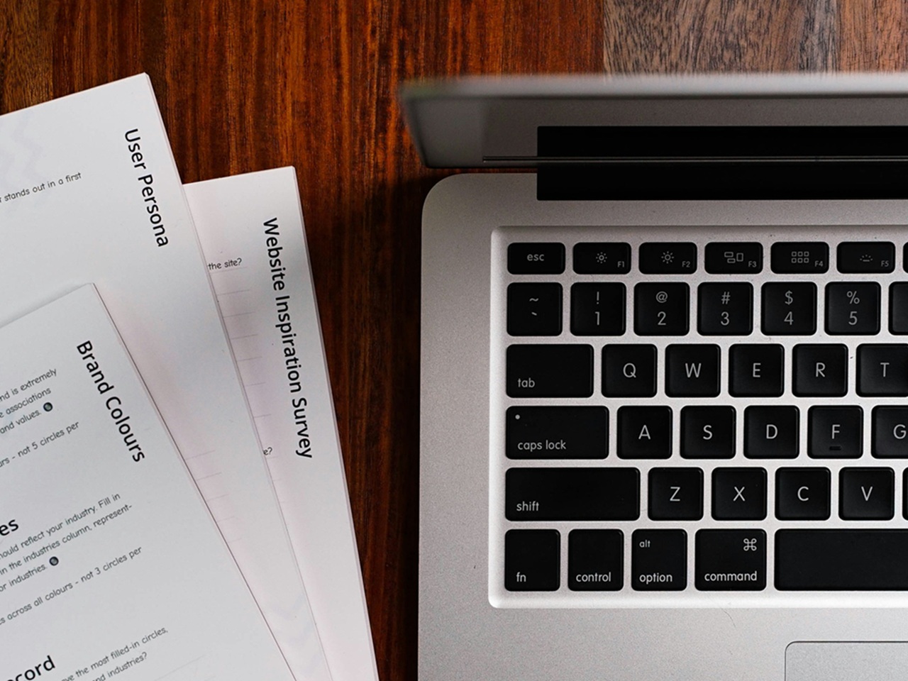 laptop keyboard and document drafts