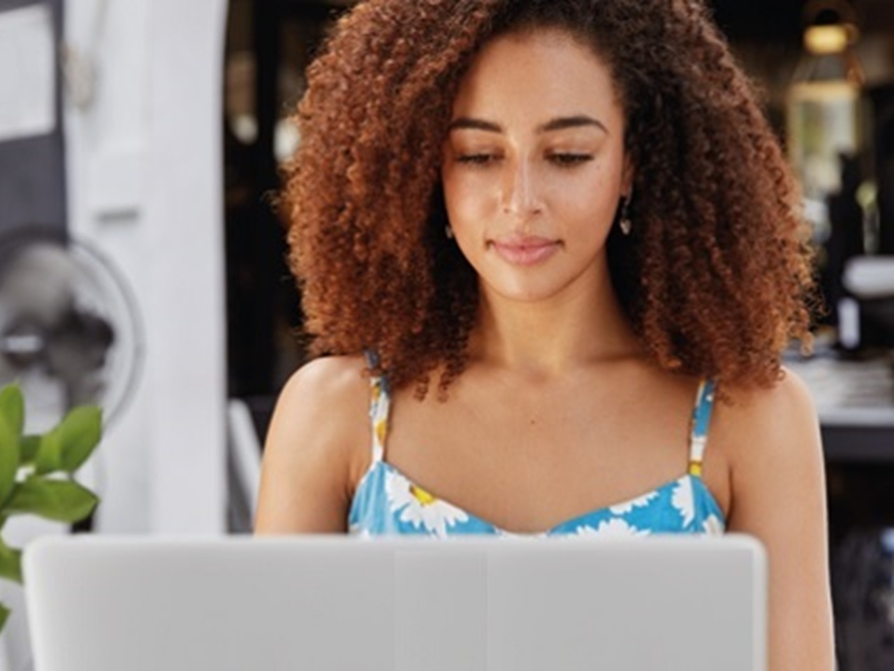 Woman looks at computer screen
