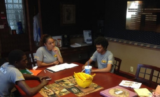 Young people at conference table