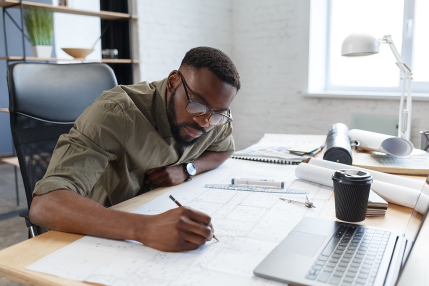 Black Man Architect perusing blueprint