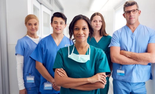 Healthcare professionals standing in hallway