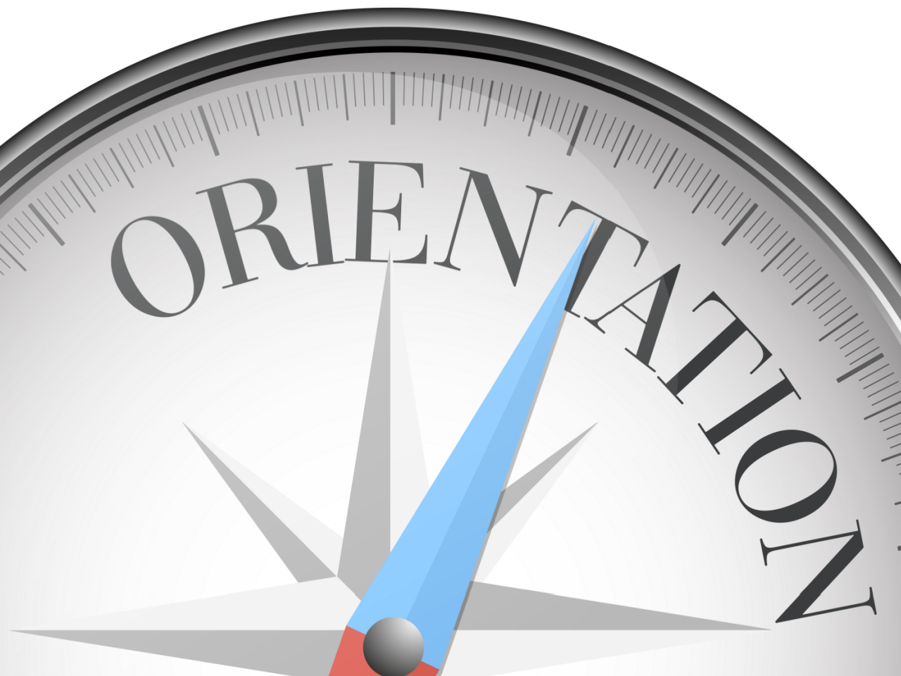 A compass with the word ORIENTATION printed on its face.