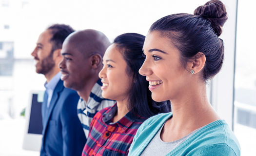 Four young individuals standing in profile with content expressions.