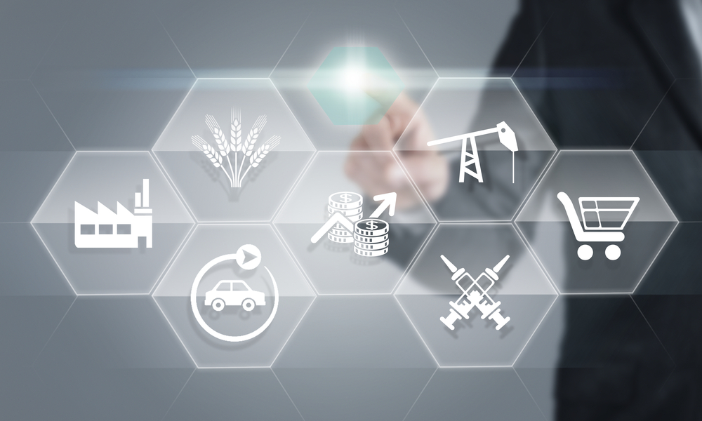 Business person touching a screen with icons representing different job sectors, like energy, agriculture, and healthcare.