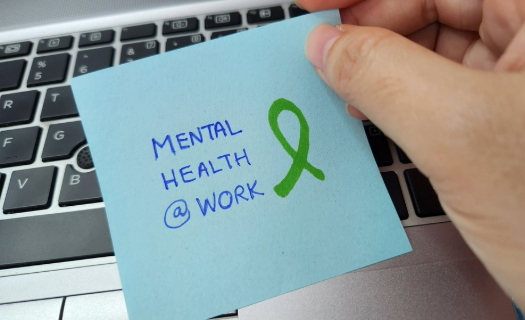 A post-it note with MENTAL HEALTH @WORK written on it.