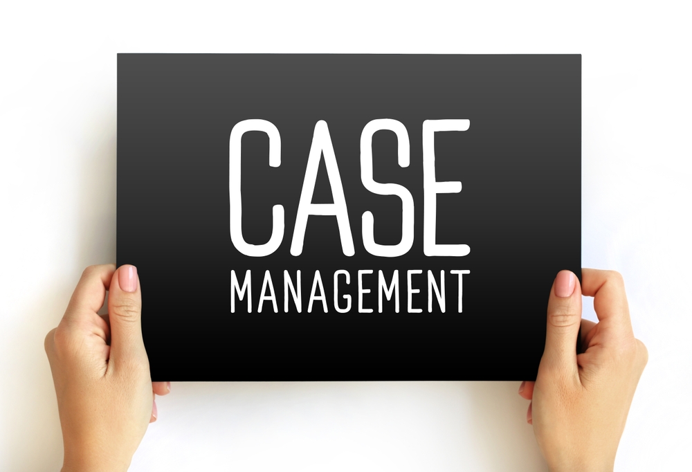 Hands gently holding a sign reading "case management"