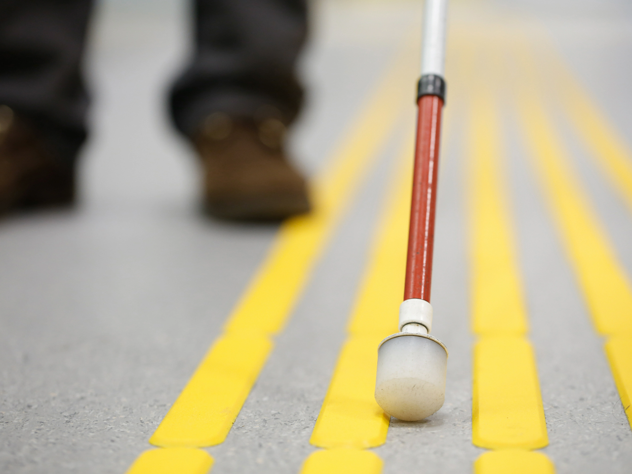 Blind person walking with cane