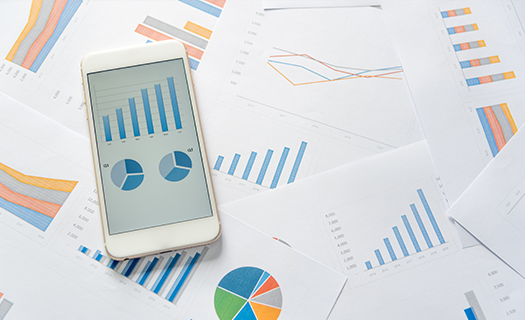 Analytics graph and pie chart on mobile phone.png