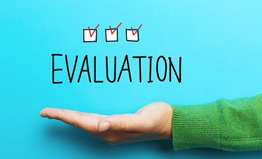 evaluation-concept-hand-on-blue-background