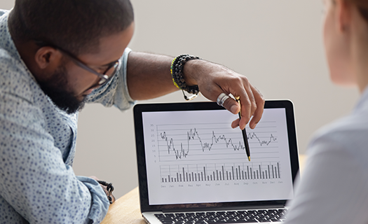 focused-african-analyst-showing-client-colleague.png