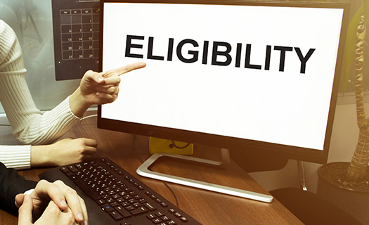 male-female-hand-computer-text-eligibility
