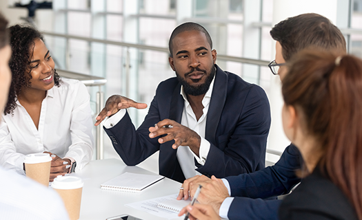 millennial-employees-gathered-boardroom-training-black
