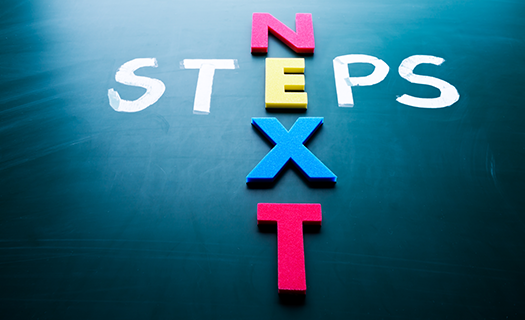 next-steps-concept-words-on-blackboard.png