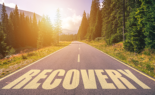 recovery-word-written-on-road-mountains.png