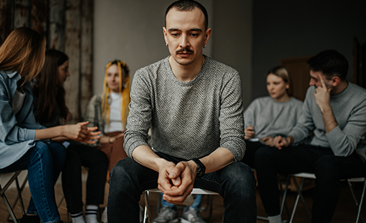 young-caucasian-man-sit-center-during