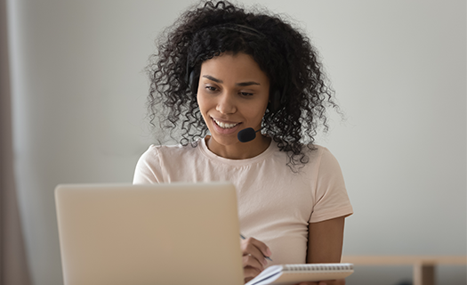 african-woman-interpreter-headset-working-home