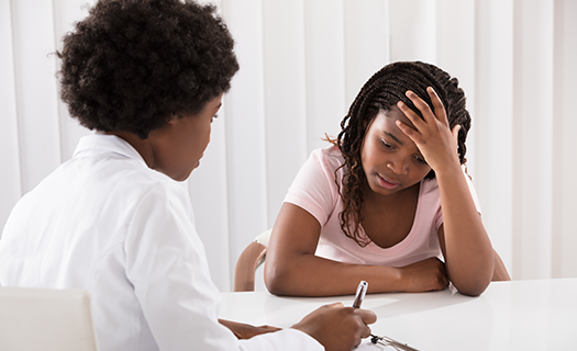 portrait-female-doctor-comforting-depressed-patient