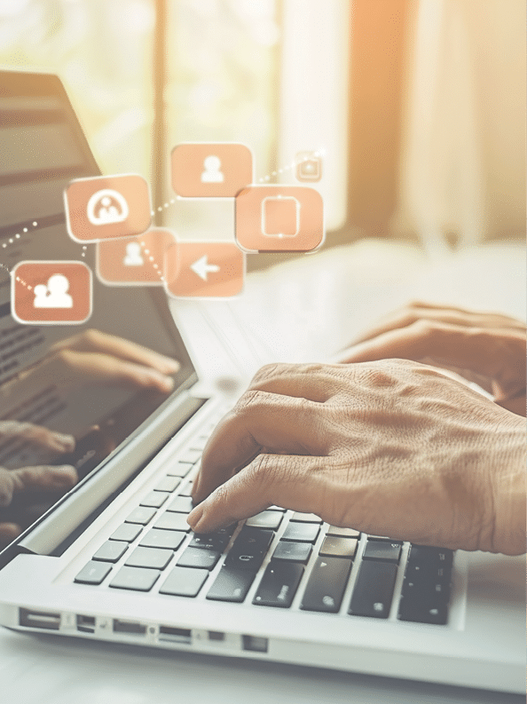 Engaging with followers online: Social media manager responding to comments on a laptop.